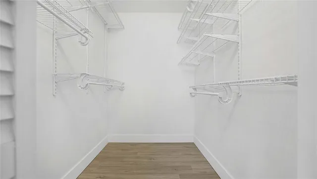 a car parked in front of a white house