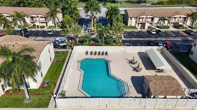 an aerial view of multiple houses with yard