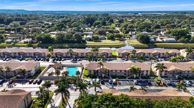a view of a patio with a table chairs and backyard