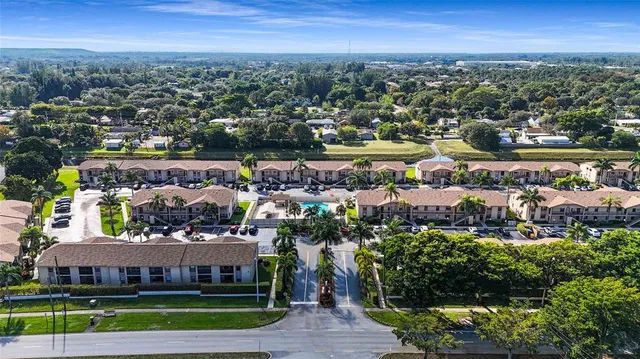 a room with furniture pool table and windows