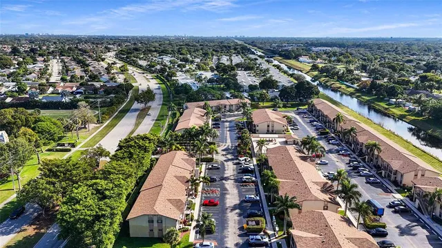 a room with pool table and windows
