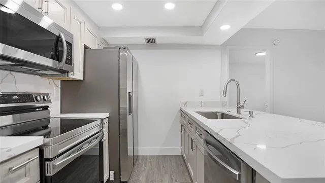 a bathroom with a sink and a large mirror