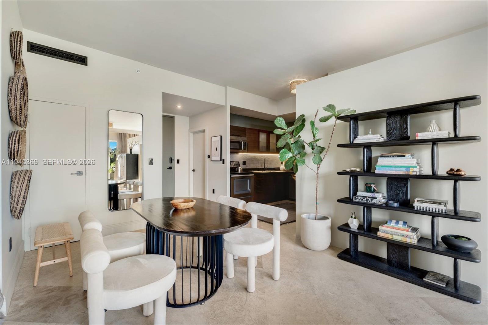 3250 Grand Avenue, Unit 306 Miami, FL 33133 - Photo 11 of 32 a living room with furniture a rug and a table