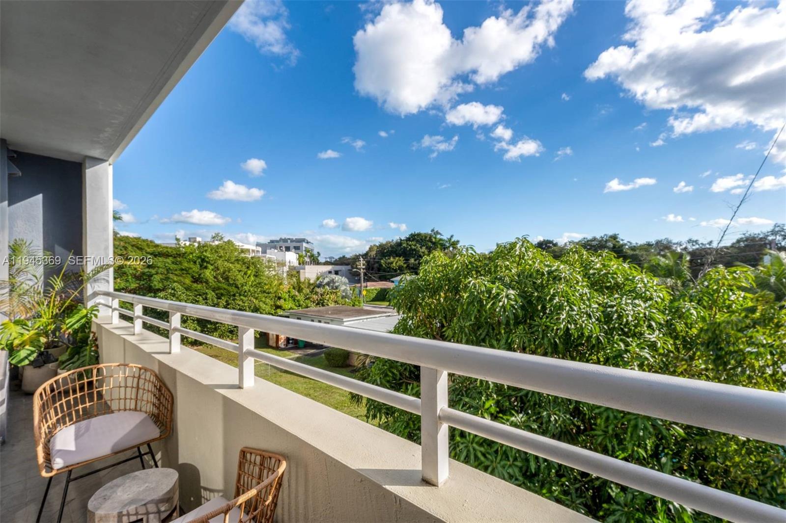 3250 Grand Avenue, Unit 306 Miami, FL 33133 - Photo 30 of 32 a view of a balcony with chairs