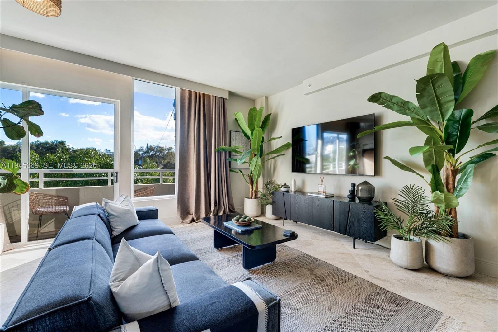 3250 Grand Avenue, Unit 306 Miami, FL 33133 - Photo 3 of 32 a living room with furniture potted plant and a window