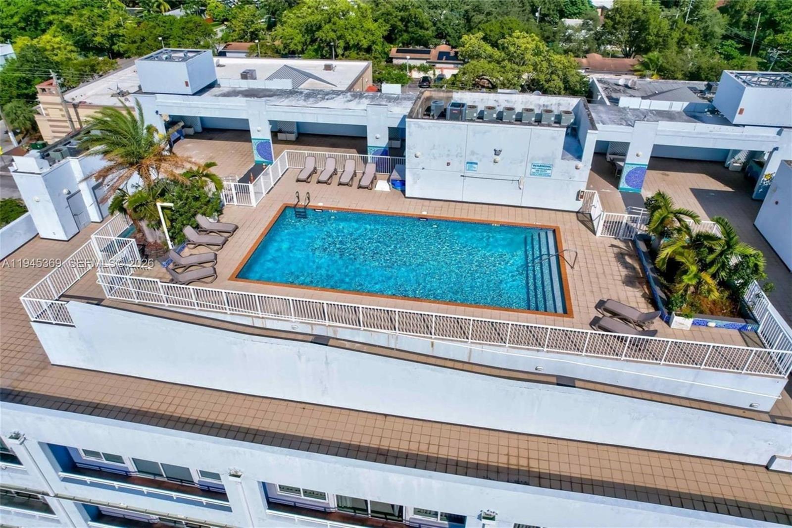 3250 Grand Avenue, Unit 306 Miami, FL 33133 - Photo 31 of 32 an aerial view of a house with a garden and plants