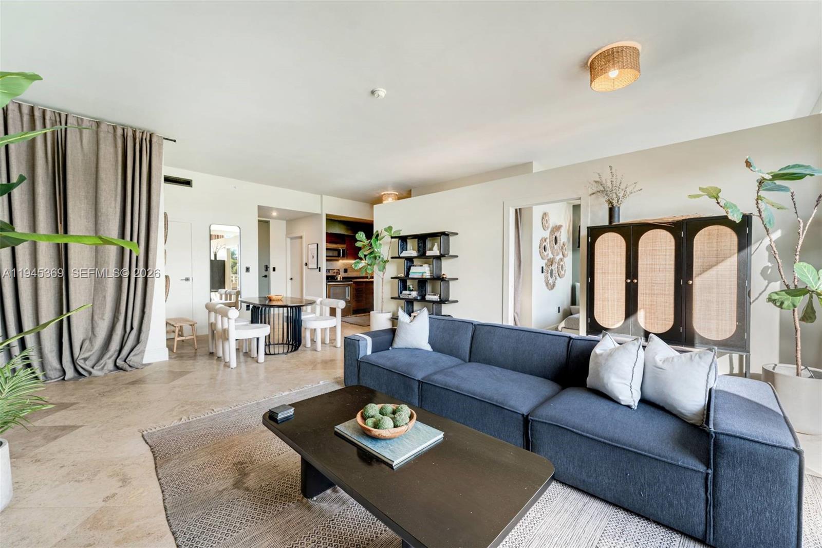 3250 Grand Avenue, Unit 306 Miami, FL 33133 - Photo 9 of 32 a living room with furniture rug and window
