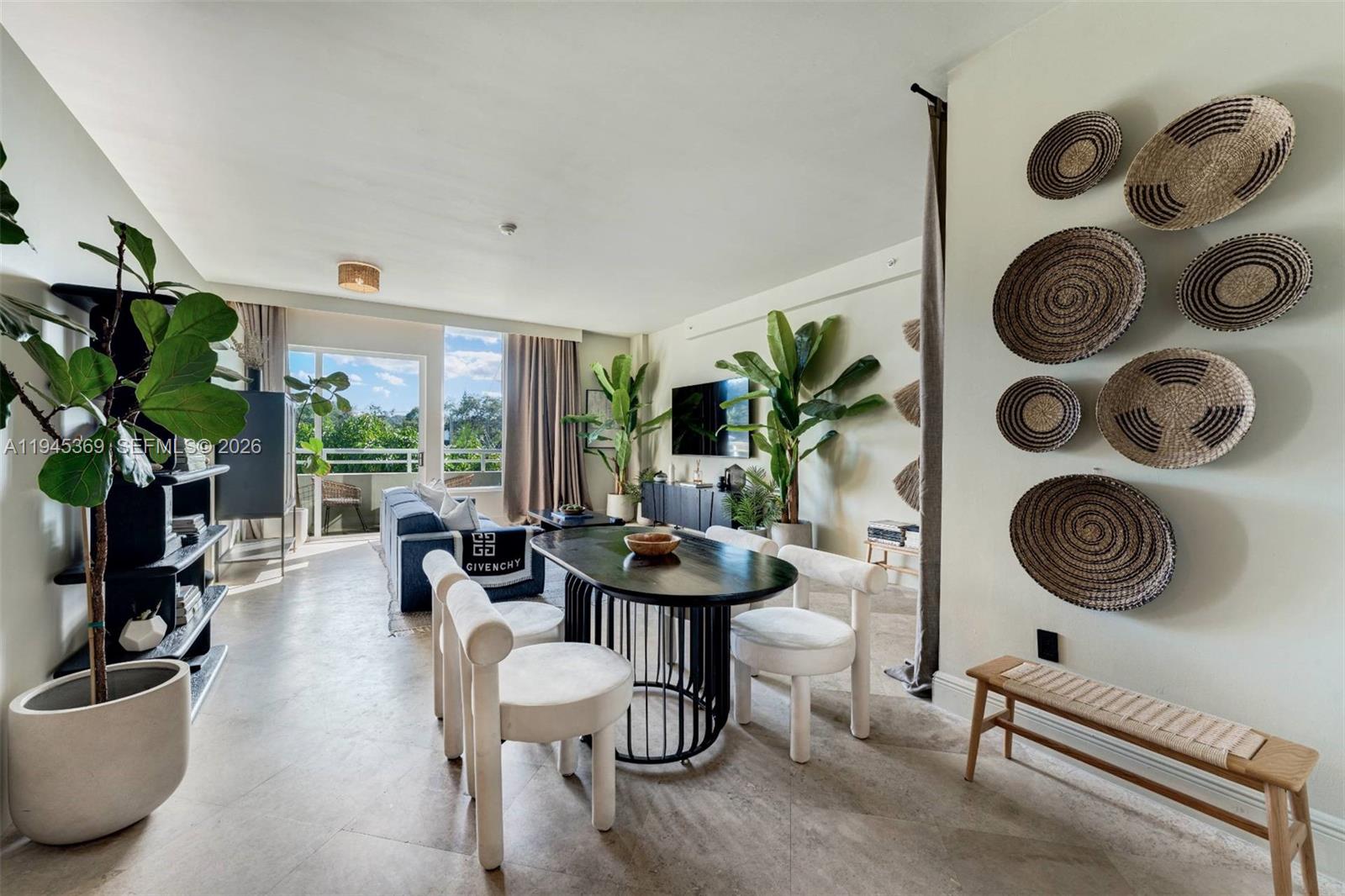 3250 Grand Avenue, Unit 306 Miami, FL 33133 - Photo 10 of 32 a living room with furniture and a floor to ceiling window