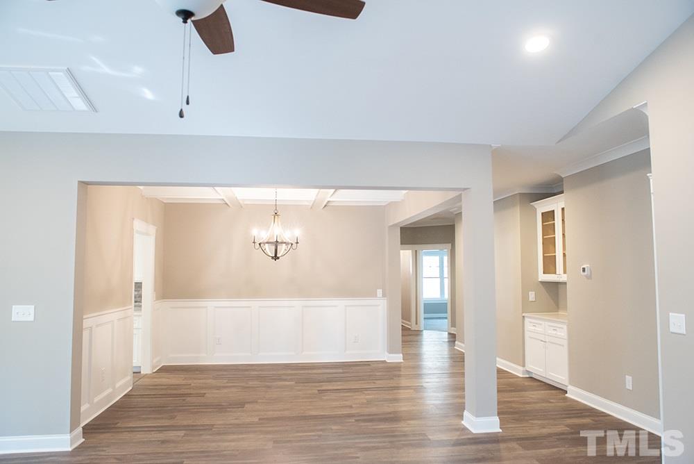 1426 Bowmantown Road Roxboro, NC 27574 - Photo 11 of 28 a view of an empty room with wooden floor