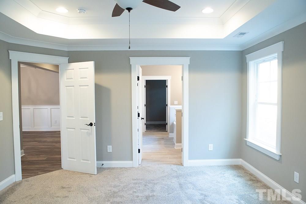 1426 Bowmantown Road Roxboro, NC 27574 - Photo 14 of 28 a view of a hallway with wooden shelves