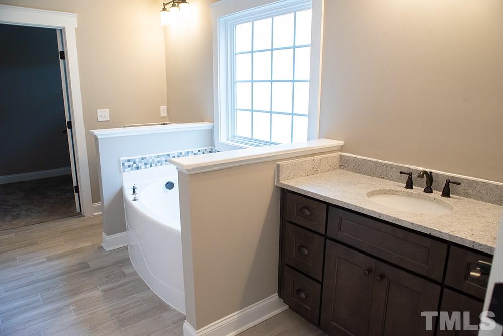 1426 Bowmantown Road Roxboro, NC 27574 - Photo 16 of 28 a utility room with a sink washer and dryer