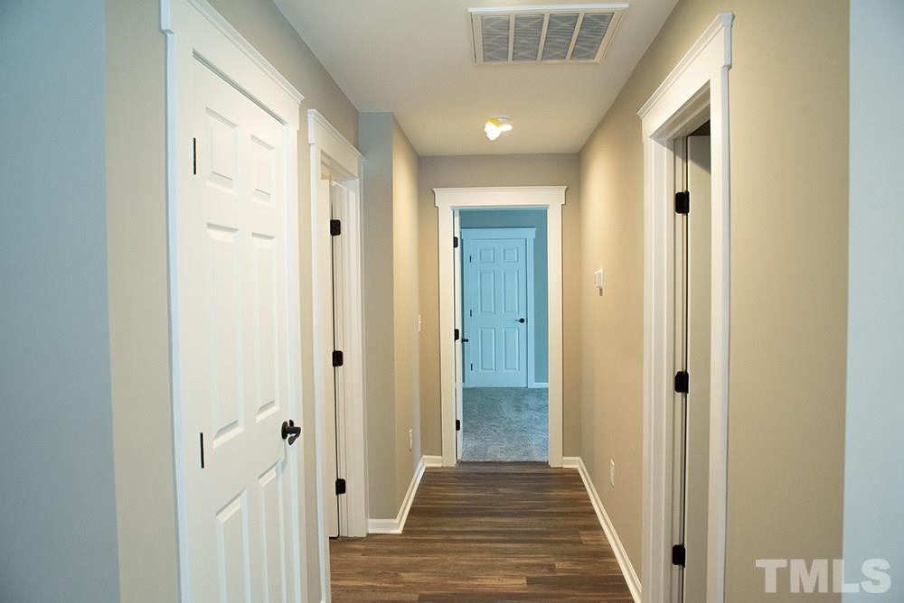 1426 Bowmantown Road Roxboro, NC 27574 - Photo 25 of 28 a view of a hallway with a wooden door