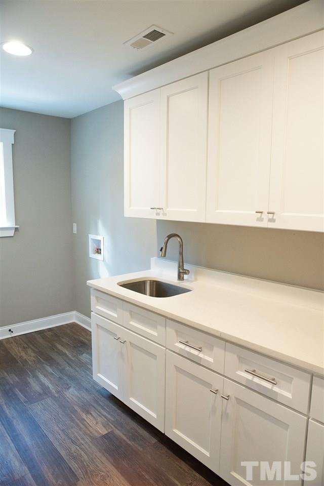1426 Bowmantown Road Roxboro, NC 27574 - Photo 28 of 28 a kitchen with a sink and cabinets