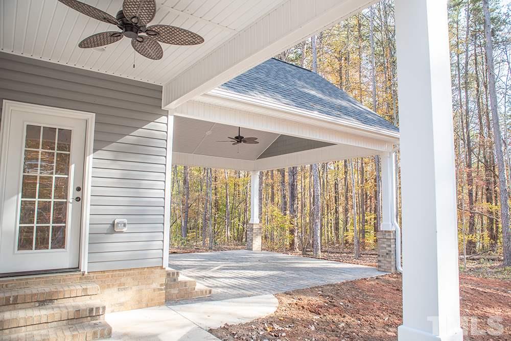 1426 Bowmantown Road Roxboro, NC 27574 - Photo 7 of 28 a view of a livingroom with a ceiling fan and window