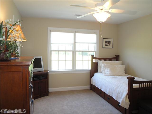 5810 Crutchfield Farm Road Oak Ridge, NC 27310 - Photo 13 of 16 4th Bedroom. The fourth bedroom offers neutral colors and is located next to the upstairs hall bath. It would make a lovely guest room or nursery!