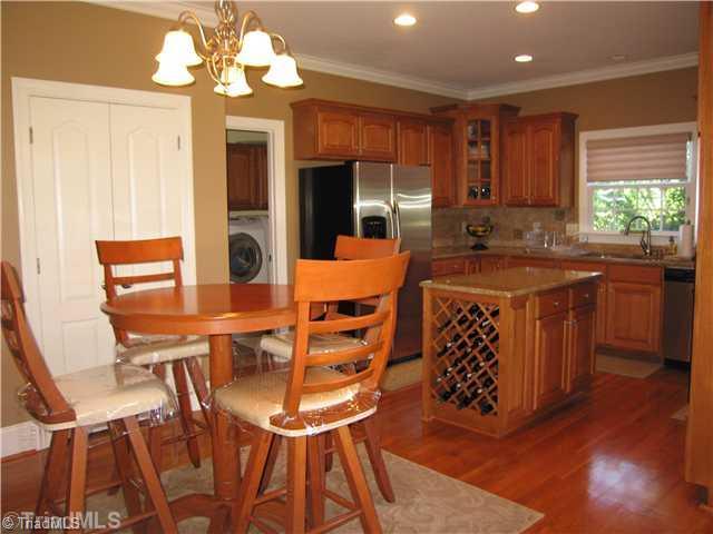 5810 Crutchfield Farm Road Oak Ridge, NC 27310 - Photo 16 of 16 Breakfast. A view of the kitchen on a larger scale offers a glimpse of the open floor plan!