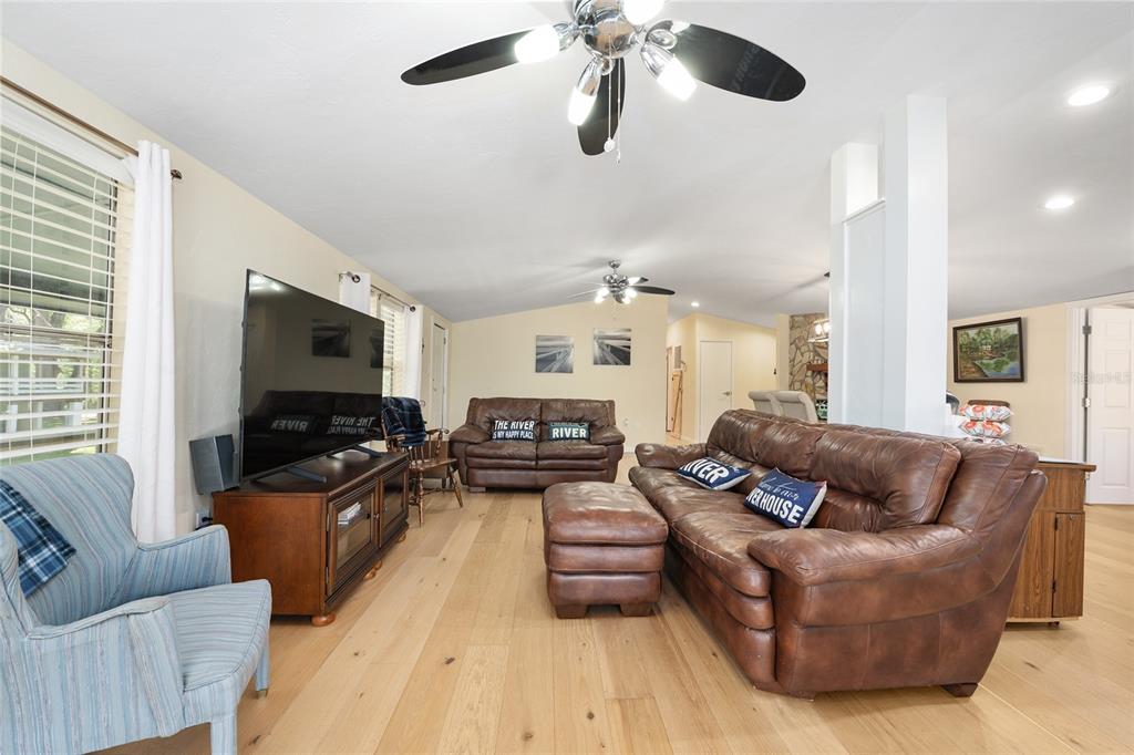 7870 Southwest 25th Place Bell, FL 32619 - Photo 67 of 99 a living room with furniture and a flat screen tv