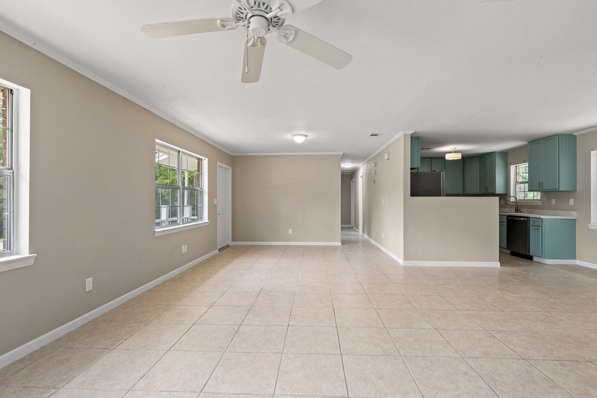 255 Brackin Street, Unit A&B Crestview, FL 32539 - Photo 15 of 70 a view of a big room with windows and chandelier fan