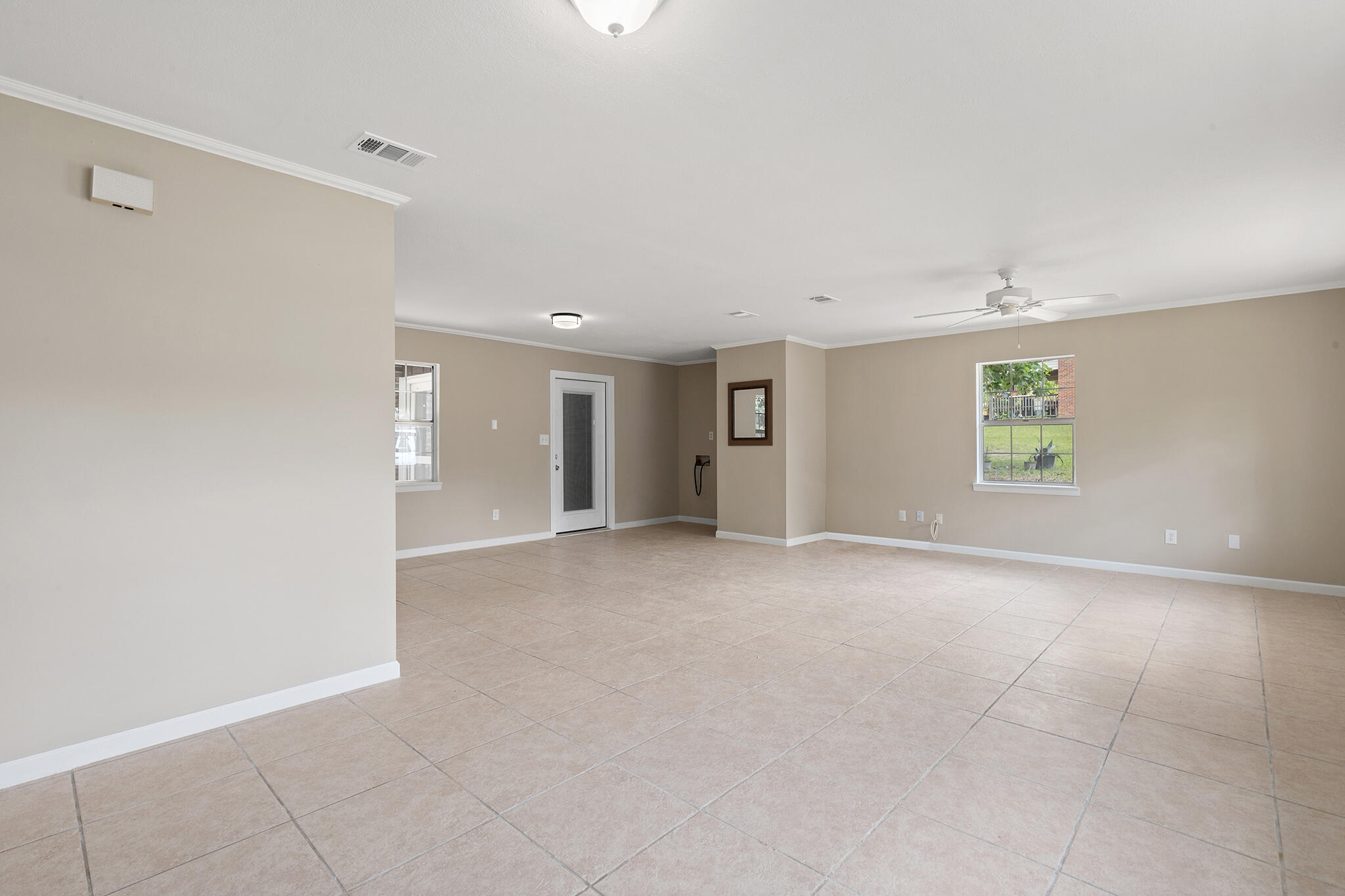 255 Brackin Street, Unit A&B Crestview, FL 32539 - Photo 17 of 70 a view of a big room with windows and chandelier fan