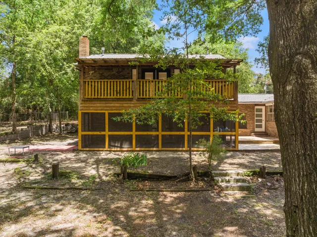 a living room with fireplace furniture and a flat screen tv