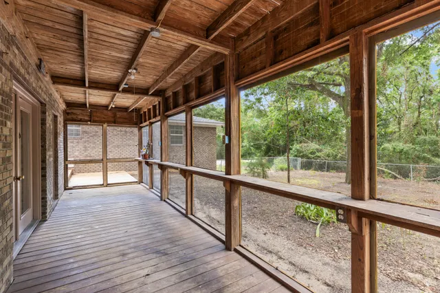 wooden floor in an empty room with a fireplace