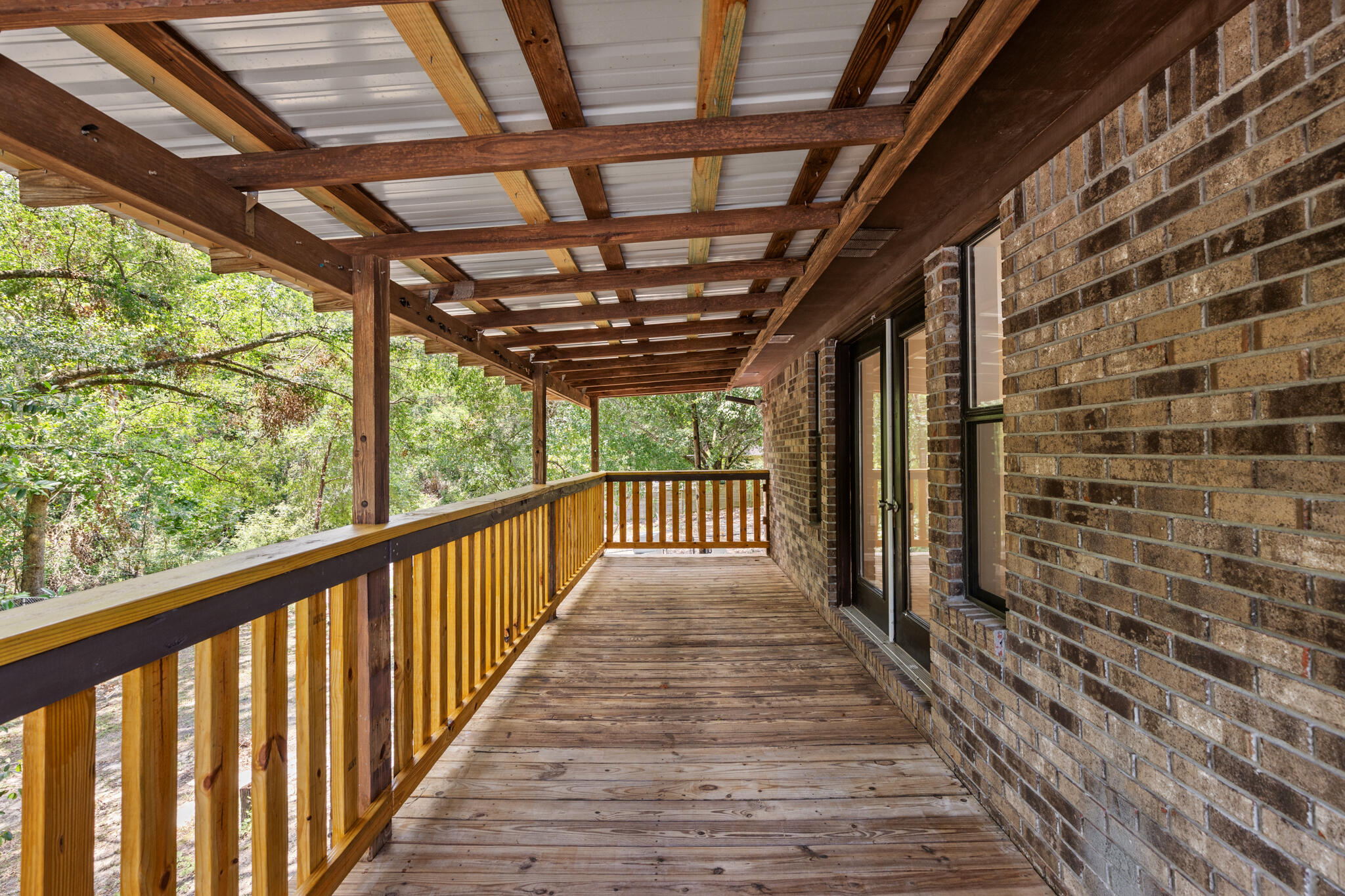 255 Brackin Street, Unit A&B Crestview, FL 32539 - Photo 42 of 70 a view of a porch with wooden floor and stairs