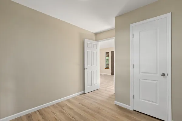 a view of a tennis ground with a large pool