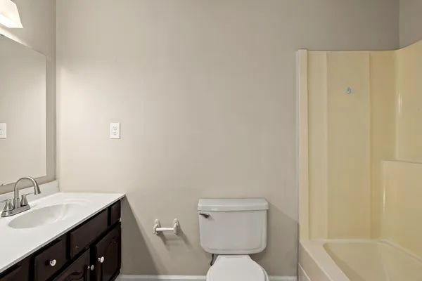 an aerial view of a house with swimming pool garden and patio