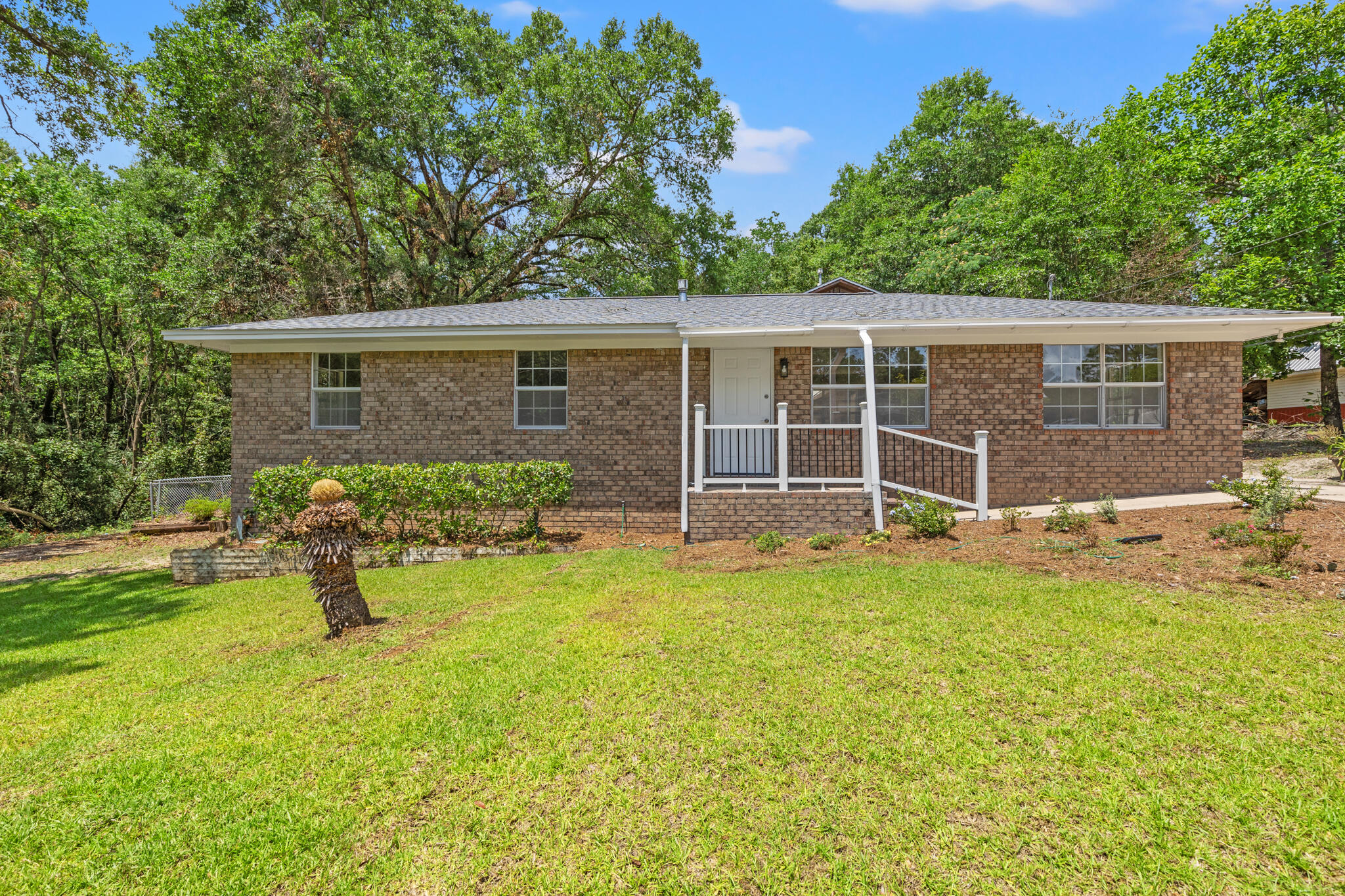 255 Brackin Street, Unit A&B Crestview, FL 32539 - Photo 7 of 70 front view of a house with a yard