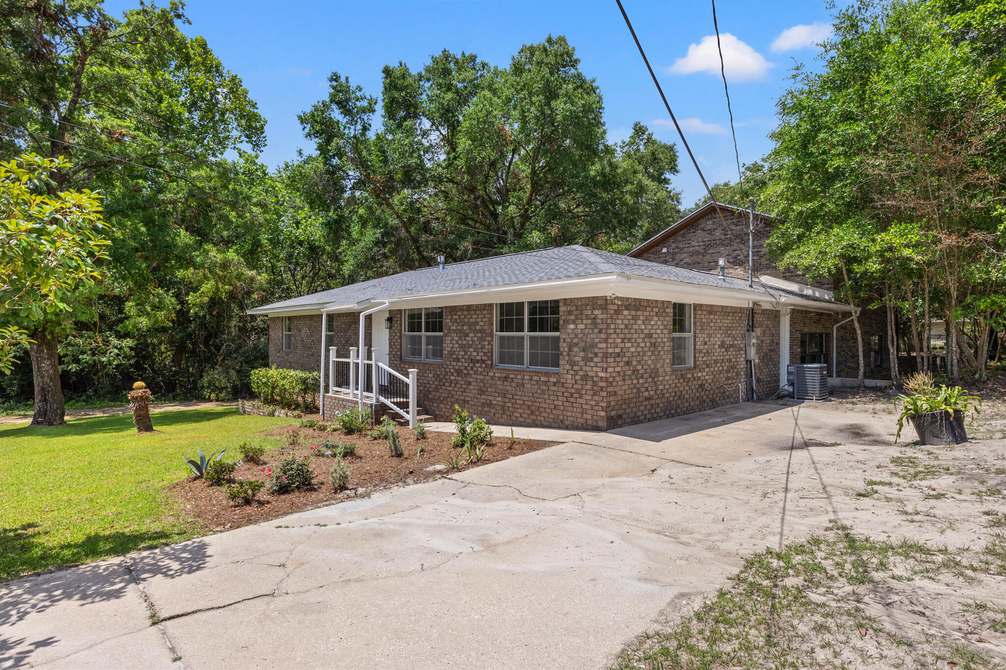 255 Brackin Street, Unit A&B Crestview, FL 32539 - Photo 8 of 70 a front view of house with yard outdoor seating and green space