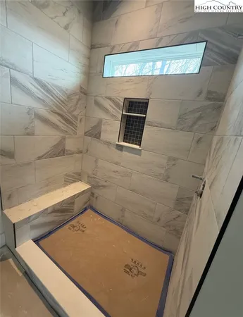 a house that has a tree in front of it