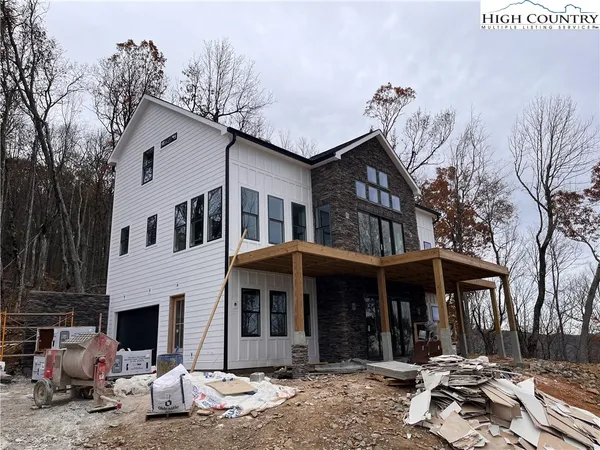a view of a brick house with many windows