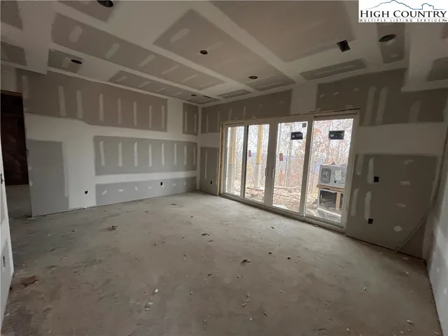 a room with lots of chairs and mirrors