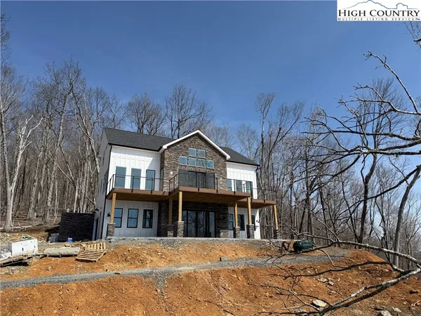 a front view of a house with parking