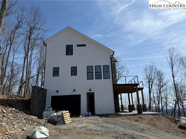 a vase of flowers sitting on a floor