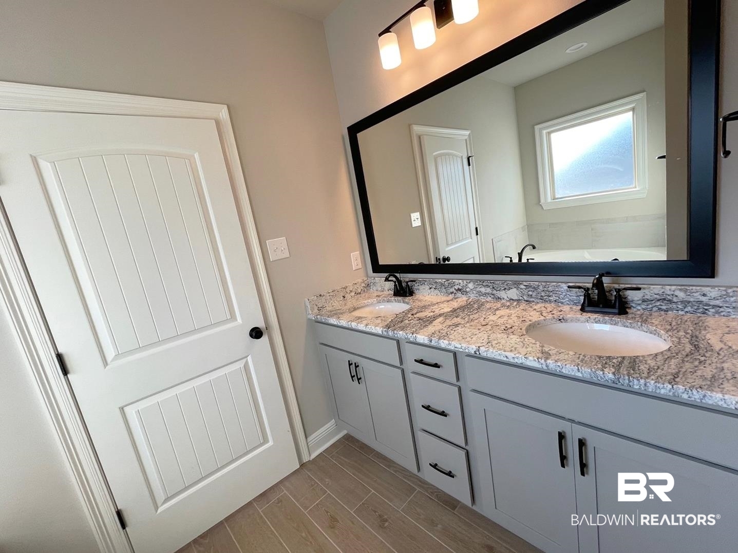 1355 Fenton Circle Foley, AL 36535 - Photo 7 of 17 Bathroom with vanity and a bath