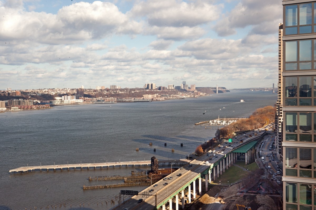 60 Riverside Boulevard, Unit 2802 Manhattan, NY 10069 - Photo 4 of 25 a view of a lake and city view