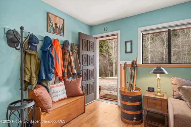 a living room with furniture fireplace and a table
