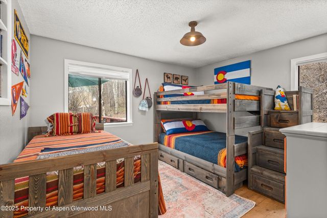 a living room with furniture fireplace and flat screen tv