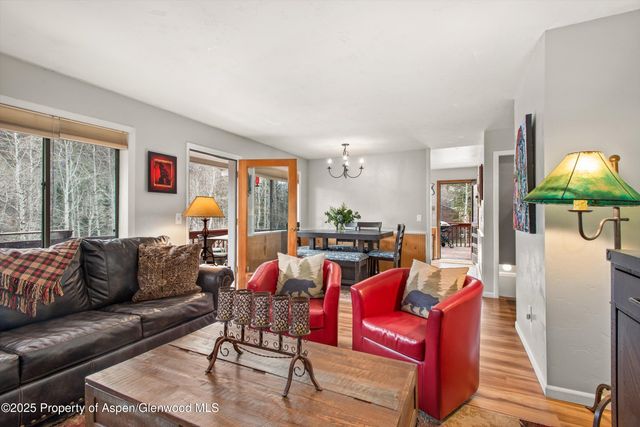 a view of balcony with chairs and table