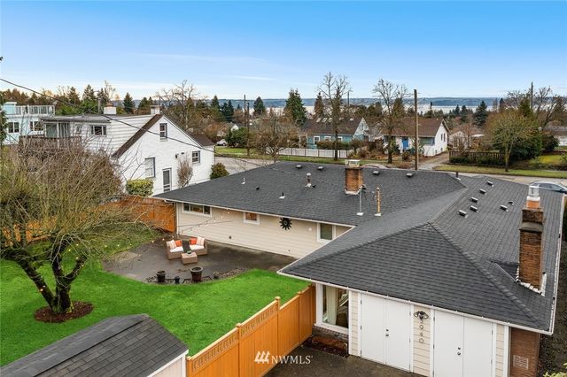 an aerial view of a house with a yard