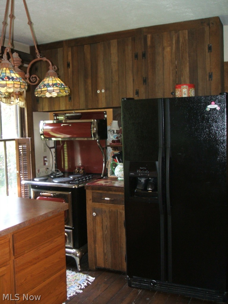 2118 North Medina Line Road Akron, OH 44333 - Photo 9 of 25 Kitchen with newer refrigerator and period replica range