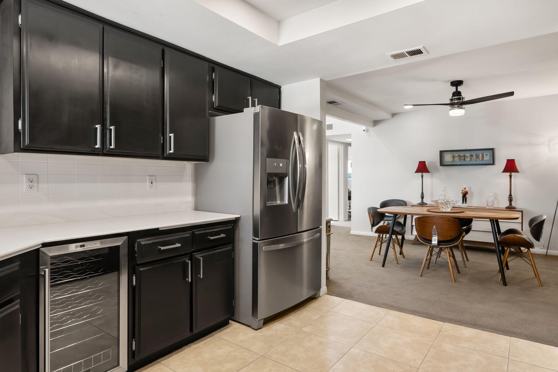 3155 Ramon Road, Unit 808 Palm Springs, CA 92264 - Photo 13 of 37 a kitchen with stainless steel appliances granite countertop a refrigerator and a table