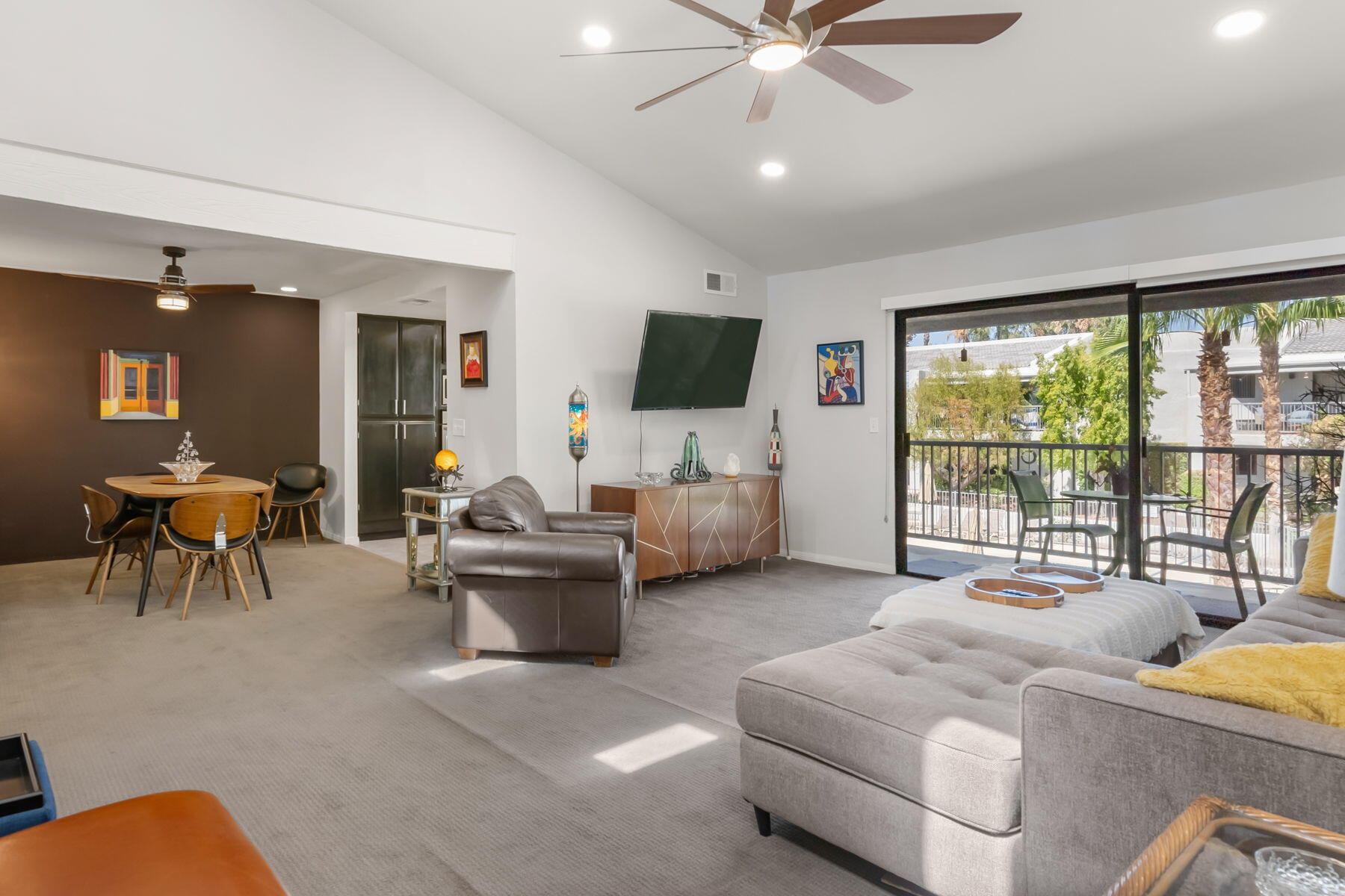 3155 Ramon Road, Unit 808 Palm Springs, CA 92264 - Photo 5 of 37 a living room with furniture and a flat screen tv