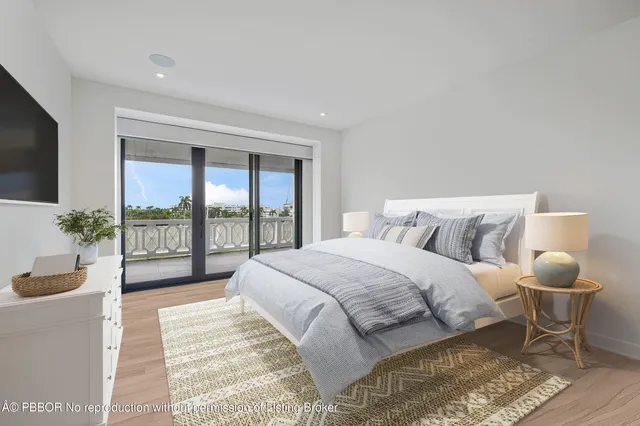 a spacious bedroom with a bed and a flat screen tv