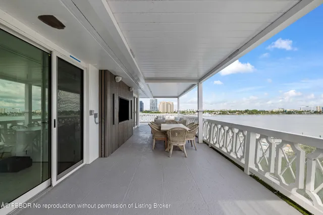 a balcony with furniture and outdoor view