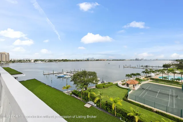 a view of a lake with houses in the back