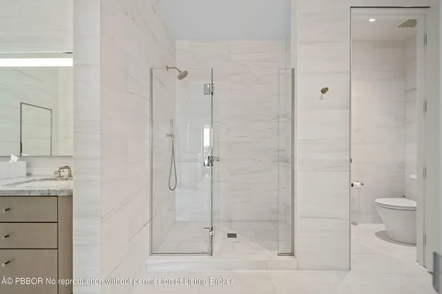 a bathroom with a shower and a toilet