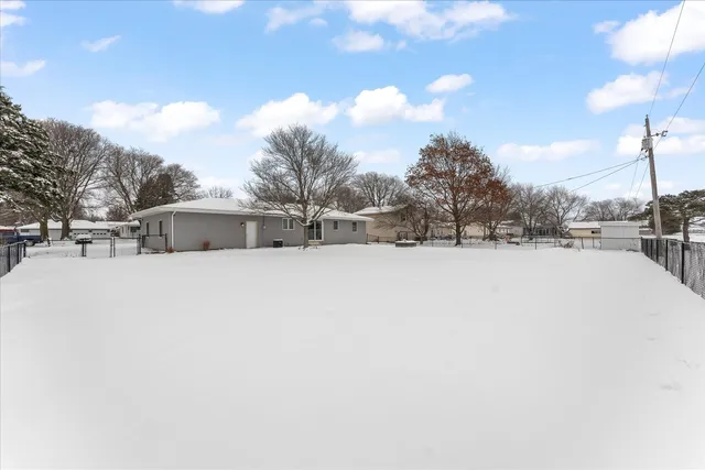 a view of house with a yard