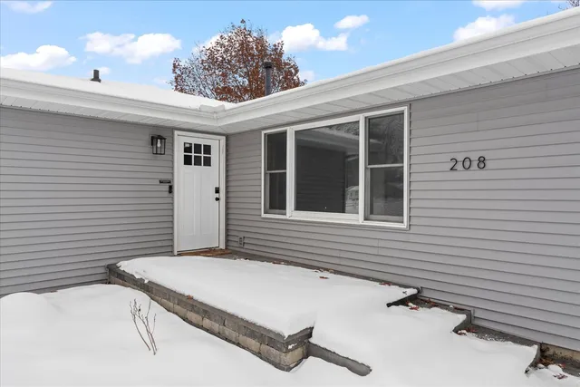 a balcony with table and chairs